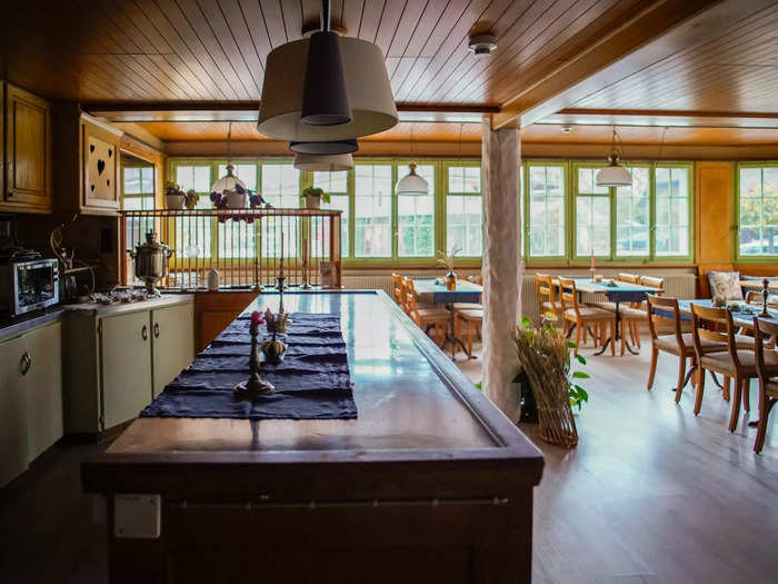 The kitchen was large enough to host an event, I thought. There were rows of long tables and chairs, and we could use any dishes. But aside from residents who I occasionally crossed paths with, it appeared empty.