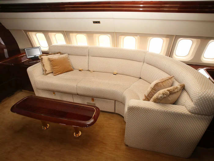 Moving through the jet, passengers will find the main lounge, which features seats, a couch, and the SkyTheater with a 57" TV and sound system that replicates a "Hollywood screening room," Miller said.