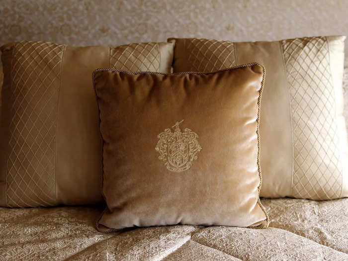 ...and the headrests and pillows have been etched with the Trump family crest.