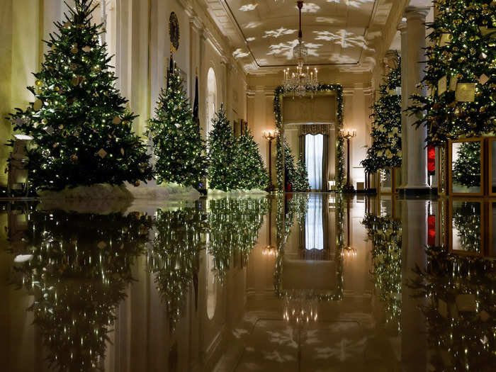 The Cross Hall of the White House glitters with twinkling lights.