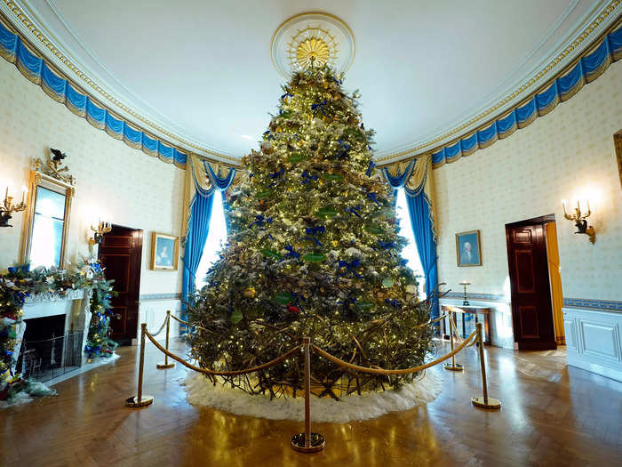 The official White House Christmas tree stands tall in the Blue Room.