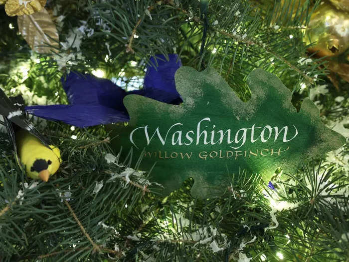 The White House Christmas Tree features handmade ornaments depicting the official bird of every US state and territory.