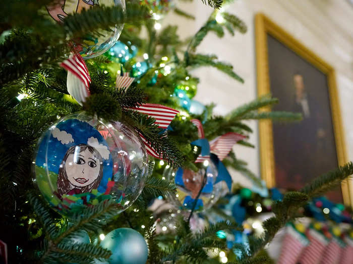 Ornaments on Christmas trees in the State Dining Room were designed by students of the 2021 Teachers of the Year from across the US.