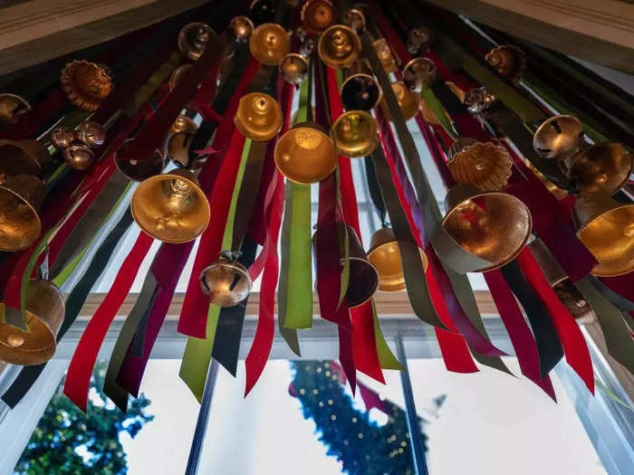 Bells hung along the entry way of the East Wing represent the "unifying and healing power of music" as they welcome guests with "melody and song."