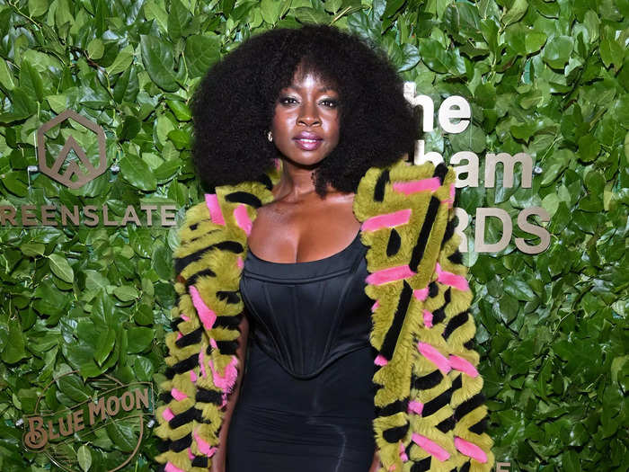 Meanwhile, her costar Danai Gurira paired a black dress with a green, pink, and black coat.