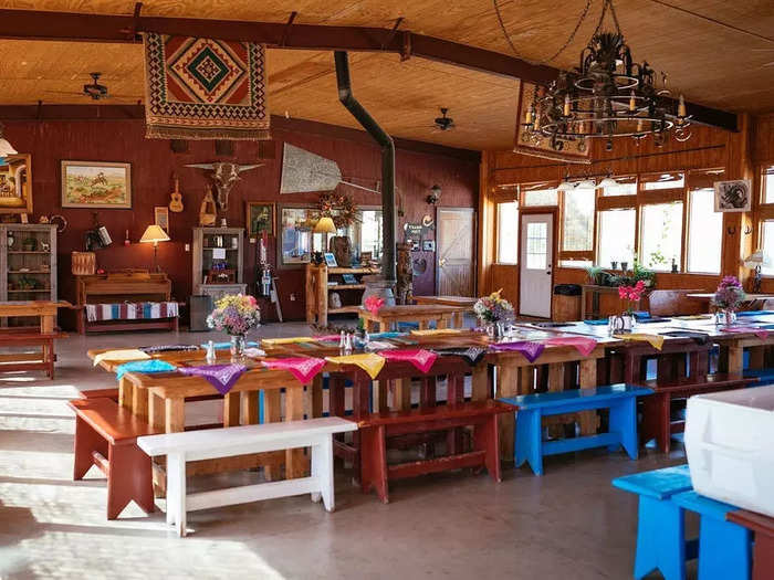 The dining area is adorned with eclectic Western-themed decor, like bandana place settings.