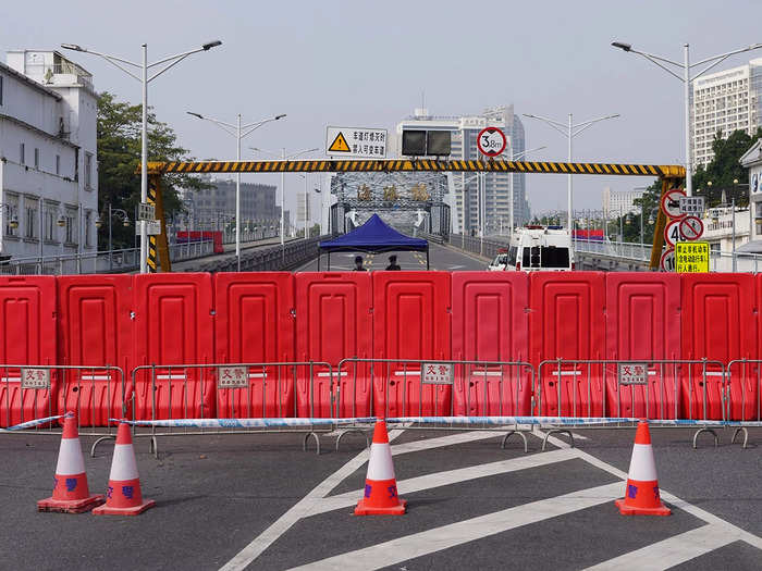 Roadblocks are set up for a security checkpoint in the Haizhu district in Guangzhou in China