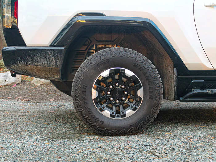 It rides on huge, knobby tires and comes with off-road features like underbody armor and recovery hooks.