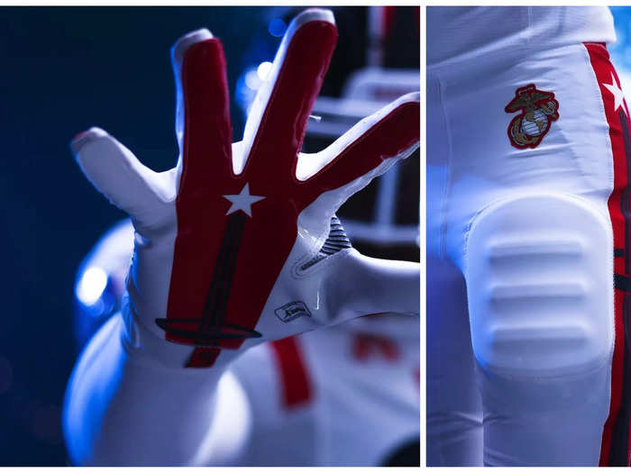 The astronaut pin is seen on the palm of the gloves and the side panels of the pants.