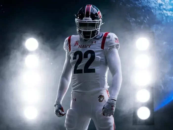 The white uniforms with red stripes were designed to mimic NASA