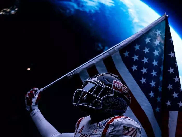 The Navy uniforms are a salute to NASA and all of the astronauts produced by the Naval Academy.