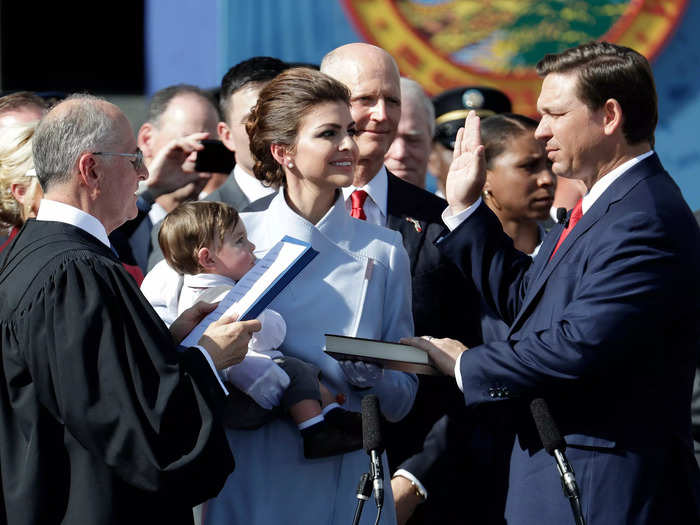 January 2019: Casey held the Bible (and Mason) as DeSantis was sworn in as governor of Florida.