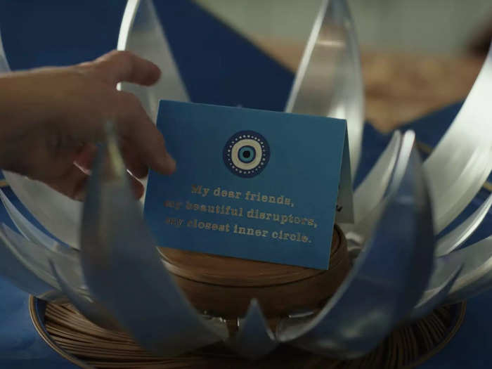 The invitation cards have an evil eye symbol on them.