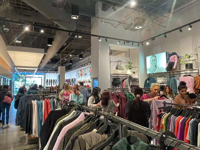 Inside, the popular athletic apparel store was packed with long checkout lines reminiscent of Black Friday before the rise of online shopping and COVID-19.