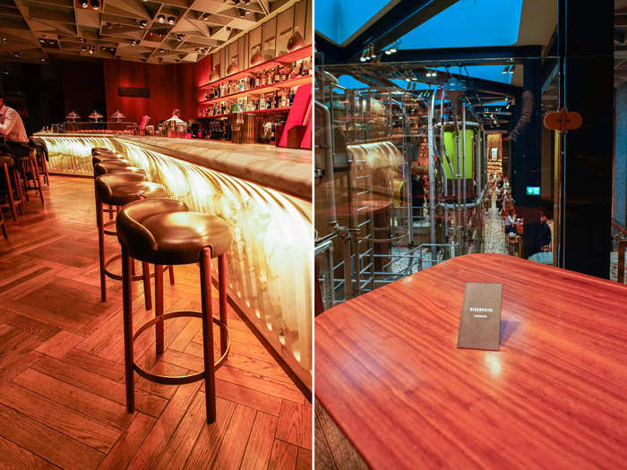 Upstairs on the mezzanine, the Arriviamo Bar serves more than 100 different cocktails on a heated, marble countertop.