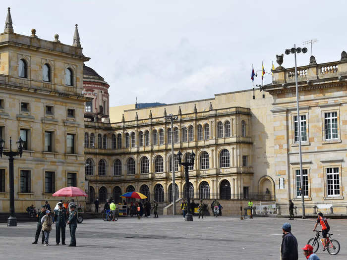 Plaza de Bolívar is a massive square in the La Candelaria area of Bogotá, surrounded by Spanish colonial architecture, government offices like the Capitol, and a variety of tour operation businesses.