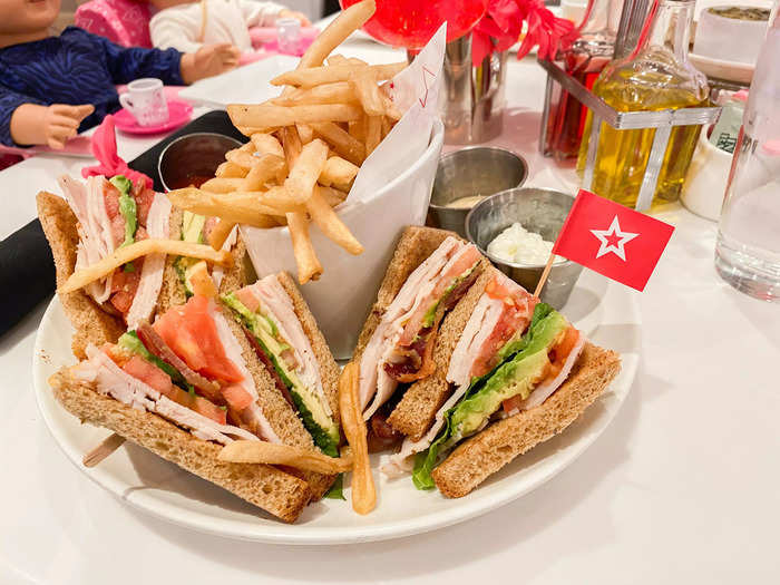 I chose the classic club sandwich with avocado and a side of French fries. The sandwiches came with little American Girl-branded flags, plus an array of dips.