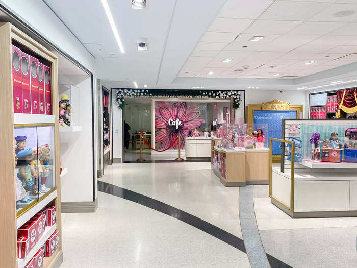 The entrance to the cafe was at the back of the store, among displays of historic American Girl dolls.