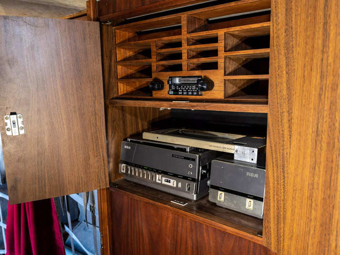 It also has an entertainment system inside a cabinet with a TV, VCR player, audio cassette player, and headphone ports.