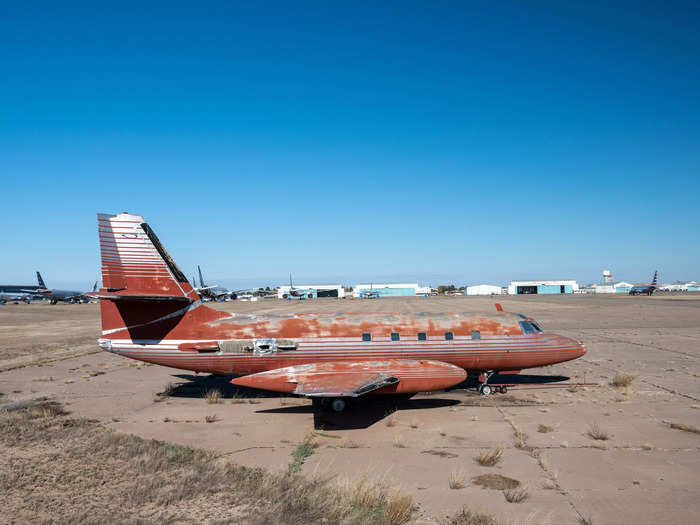 The private jet has a red interior with silver accents but needs repairs.