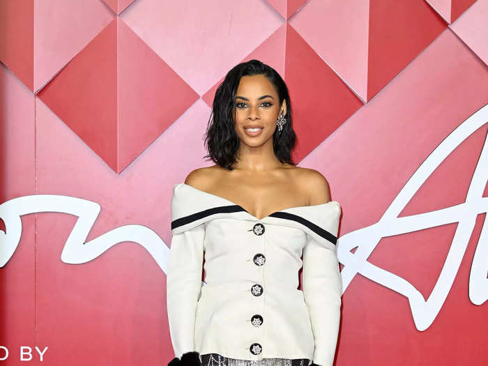 Musician Rochelle Humes walked the red carpet in tights, pumps, and an off-the-shoulder blazer with crystal fringe from Celia Kritharioti.