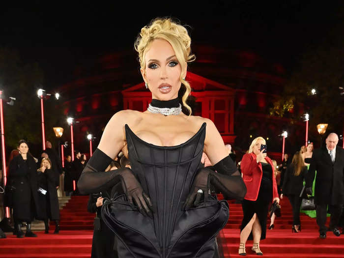 Christine Quinn of "Selling Sunset" put a unique twist on the corset trend. Her black gown had sharp padding at the waist and a fishtail skirt with a deep slit.