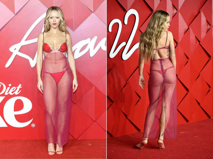 Rita Ora wore a red Nensi Dojaka ensemble, which consisted of a bikini top and coordinating thong with a form-fitting, sheer overlay.