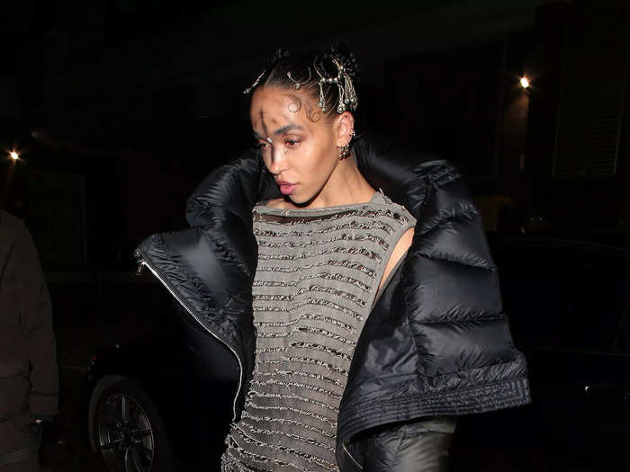 FKA Twigs wore a floor-length gray dress with a black padded jacket.