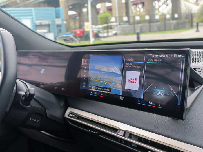 The digital instrument cluster and main touchscreen both lie on a single panel that