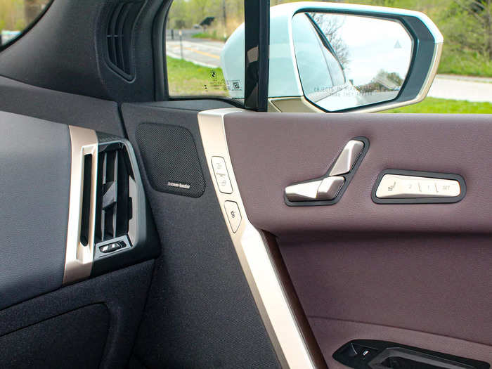 The seat controls on the door were the same metallic gold seen elsewhere in the vehicle.