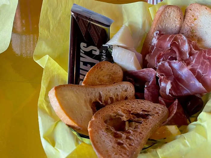 The Grown Up Lunchable is $18 and includes toasted bread, cheese, prosciutto, and a chocolate bar.