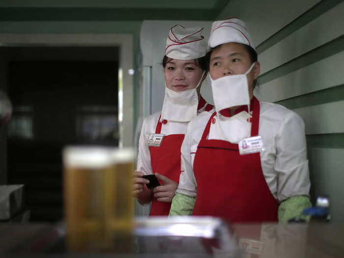 The state-owned Taedonggang Beer company has a shop in Pyongyang, where people can stop in for a drink.