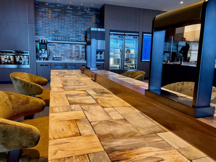 Towards the back of the space is a wine bar made of petrified wood…