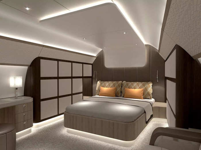 Towards the back of the jet lies a huge master bedroom, complete with desk space, storage, and beautiful finishings.