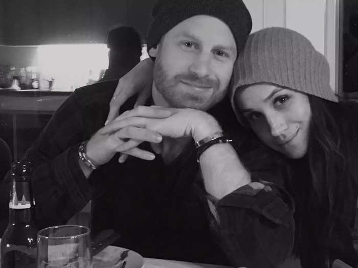 Another previously unreleased photo shows Harry and Meghan wearing beanies in an undisclosed location.