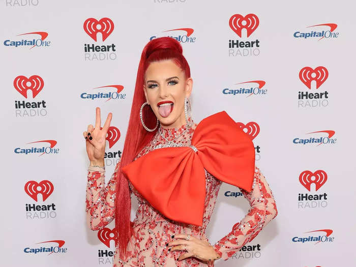 Musician Justina Valentine wore a festive dress with a giant bow attached.