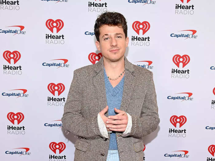 Charlie Puth mixed prints, colors, and textiles with his outfit.