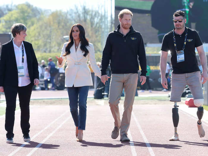 Markle looked more casual in loose-fitting jeans and a white jacket at the Invictus Games in 2022.