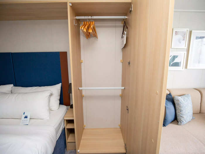 This bulky tan structure served two purposes: It provided ample storage space and helped separate the bed from the living room and bathroom.