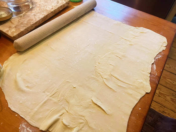I then started rolling out my puff pastry dough on a lightly floured surface.