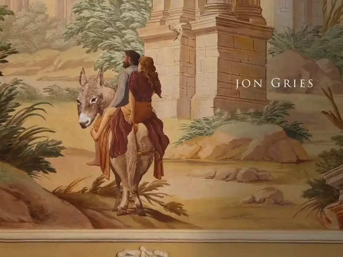 The name of the actor playing Greg is shown alongside a couple who appear to be riding away on a donkey.