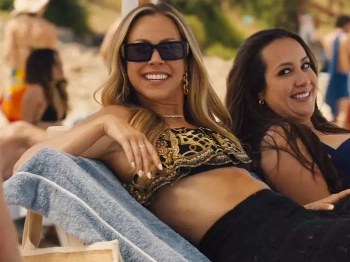 The two women Daphne is seen chatting to on the beach in the opening scene are contestants from the reality show "Survivor."