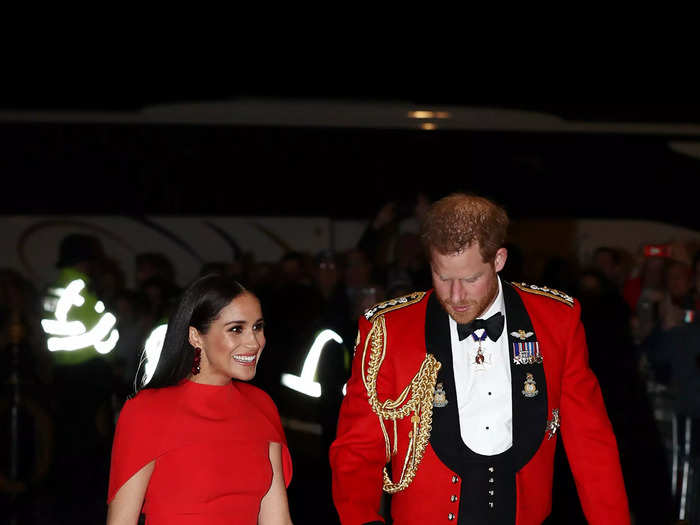 Two days later, Meghan arrived at another royal engagement in a scarlet red ballgown.