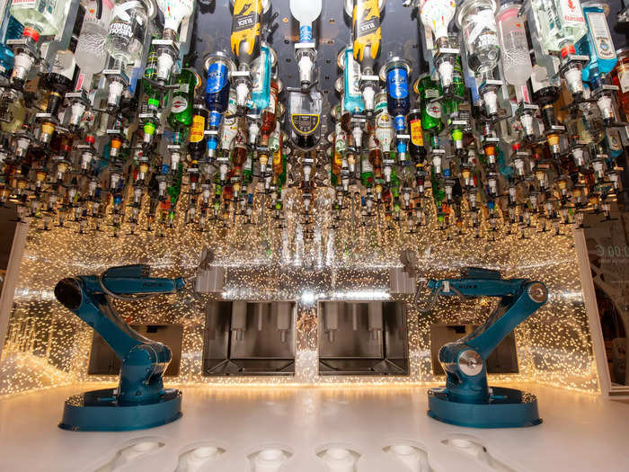 Here, the Wonder of the Seas has a bar staffed by robotic arms instead of bartenders …