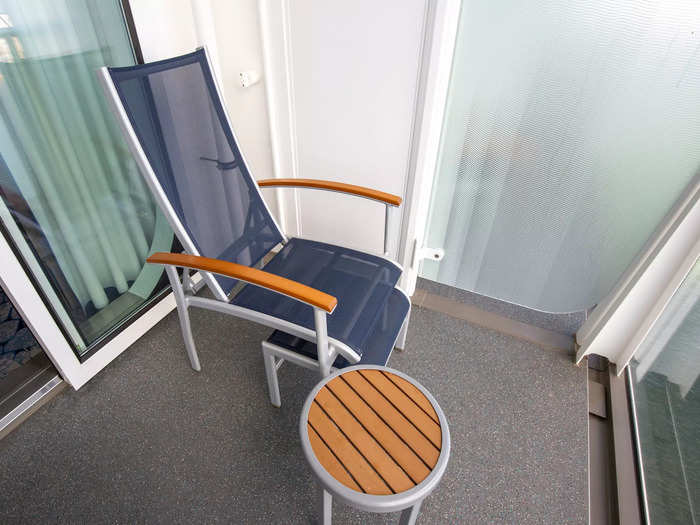 The furnished balcony, located at the far end of my hotel room at sea, was like any other.