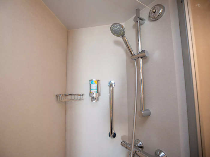 … a glass-walled shower next to the toilet …