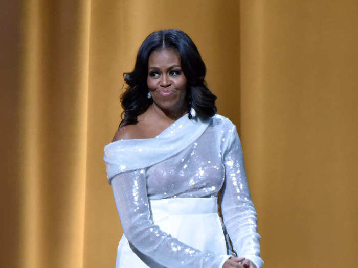 Michelle Obama kicked off her first book tour in November 2018 while wearing a sparkling, off-the-shoulder shirt.