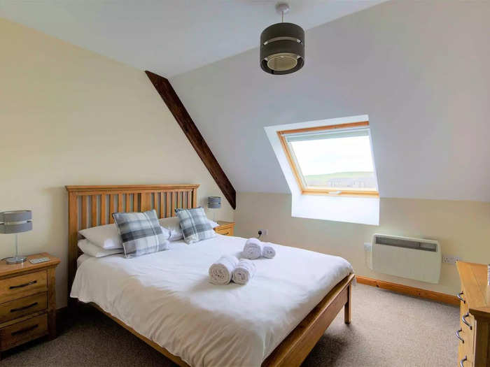 Original wooden beams can be seen on the ceilings of the bedrooms, living rooms, and kitchens.