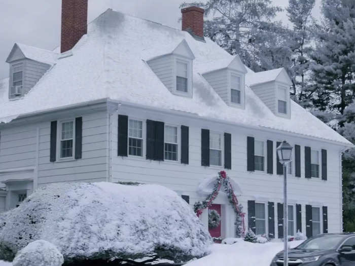 The Kentsbury Inn is a large white colonial-style building with a red door.