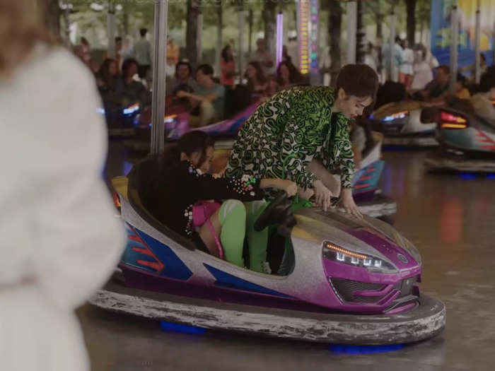 Emily and Mindy very dangerously exit a bumper car while the rest are still going.